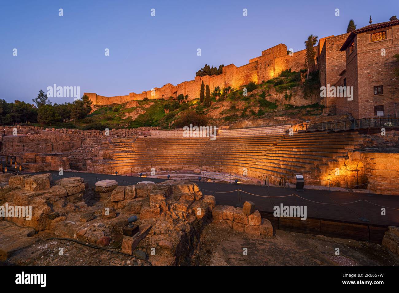 Alcazaba, the fortress palace (citadel) with ruins of roman theater in foreground, Malaga, Spain. Stock Photo