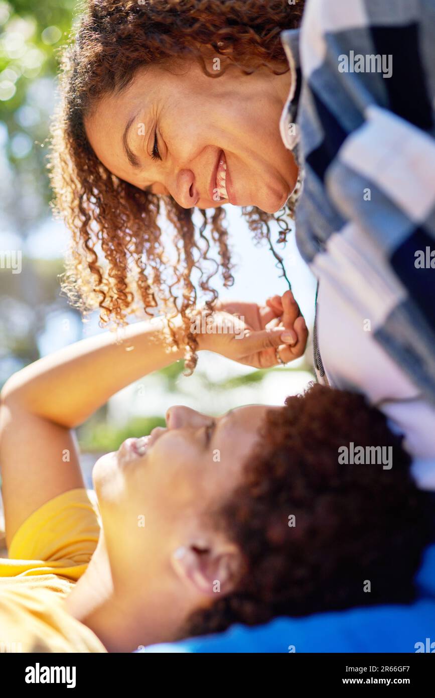 Close up happy, affectionate lesbian couple talking face to face Stock Photo