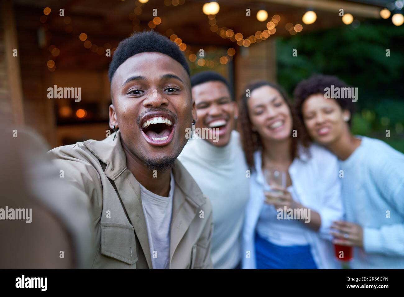 Selfie POV portrait happy gay couples laughing in backyard Stock Photo