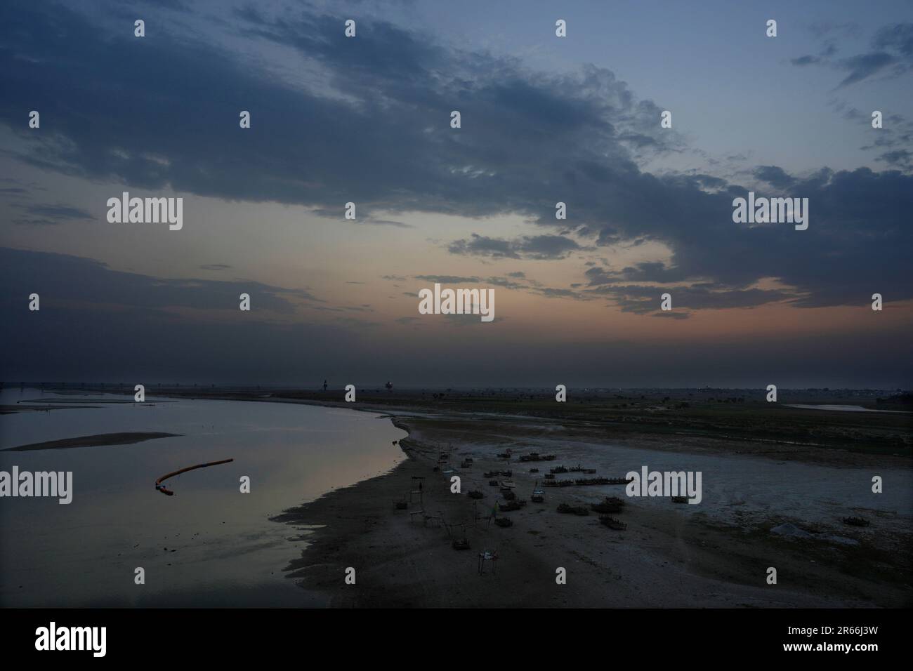 The dried up riverbank of the Ganges is seen from a bridge in ...
