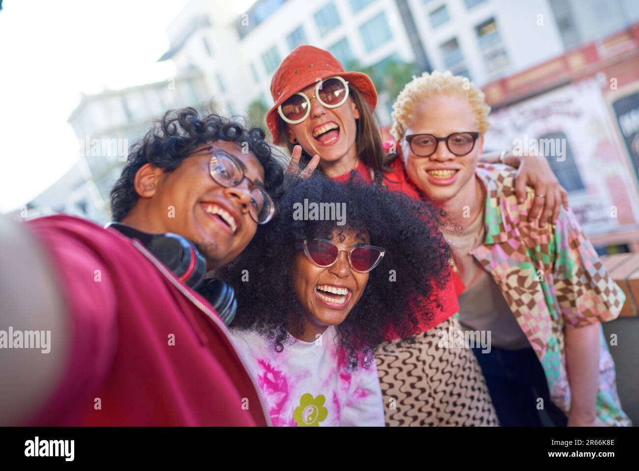 Selfie POV portrait happy young friends on urban balcony Stock Photo