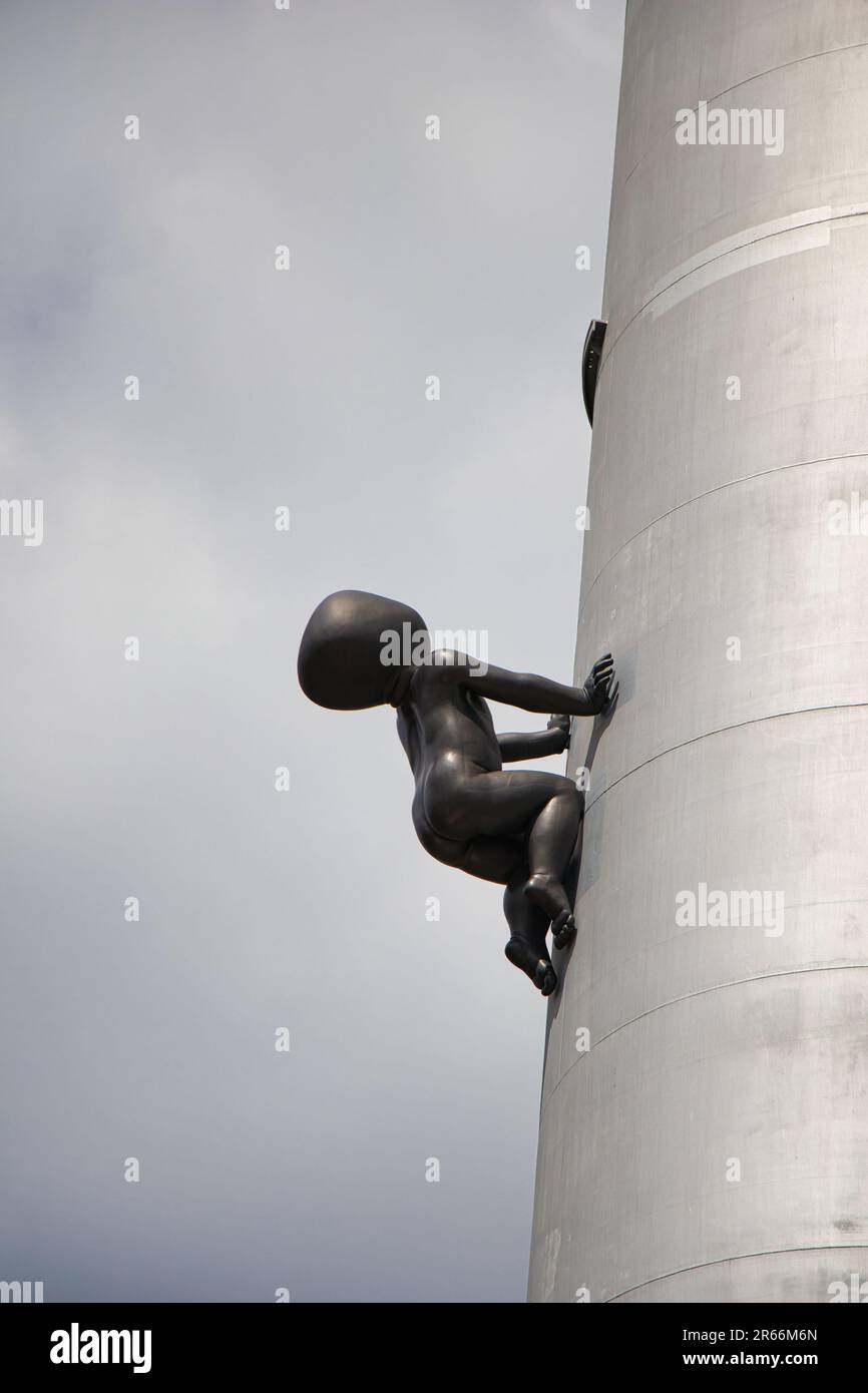 Sculpture of a bronze crawling babies called Miminka at the Zizkov TV Tower. Designed by David Cerny. Stock Photo