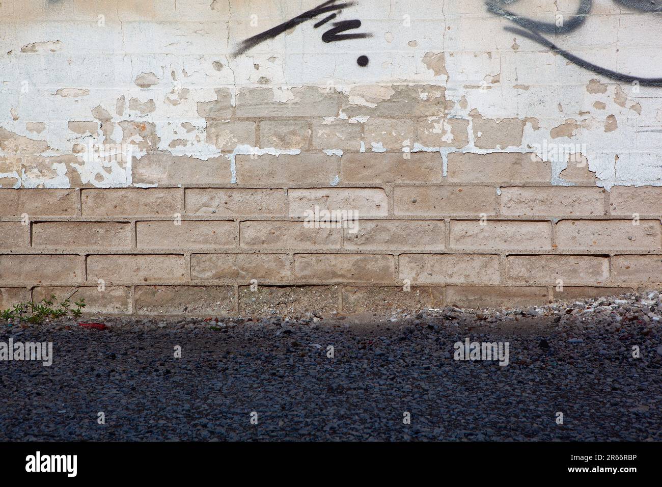 Background of partial painted white brick wall with peeling texture and ...