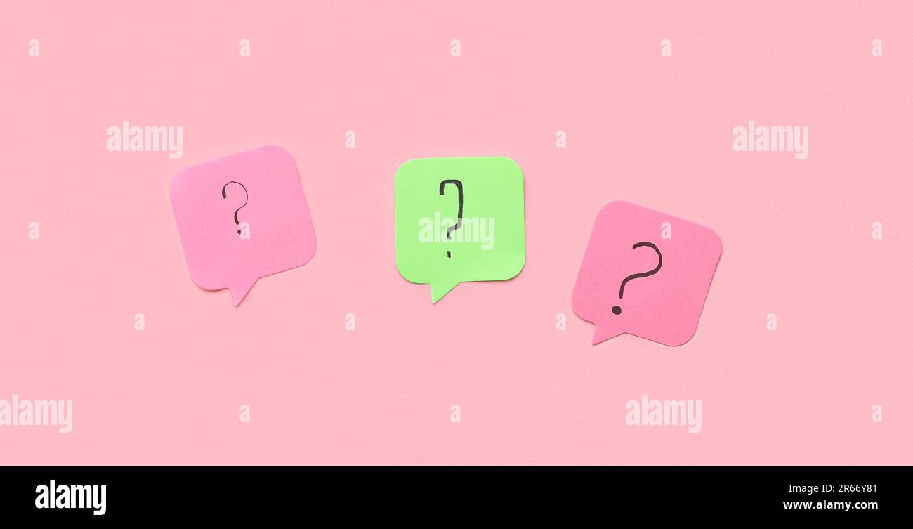 Sticky papers with question marks on pink background Stock Photo - Alamy