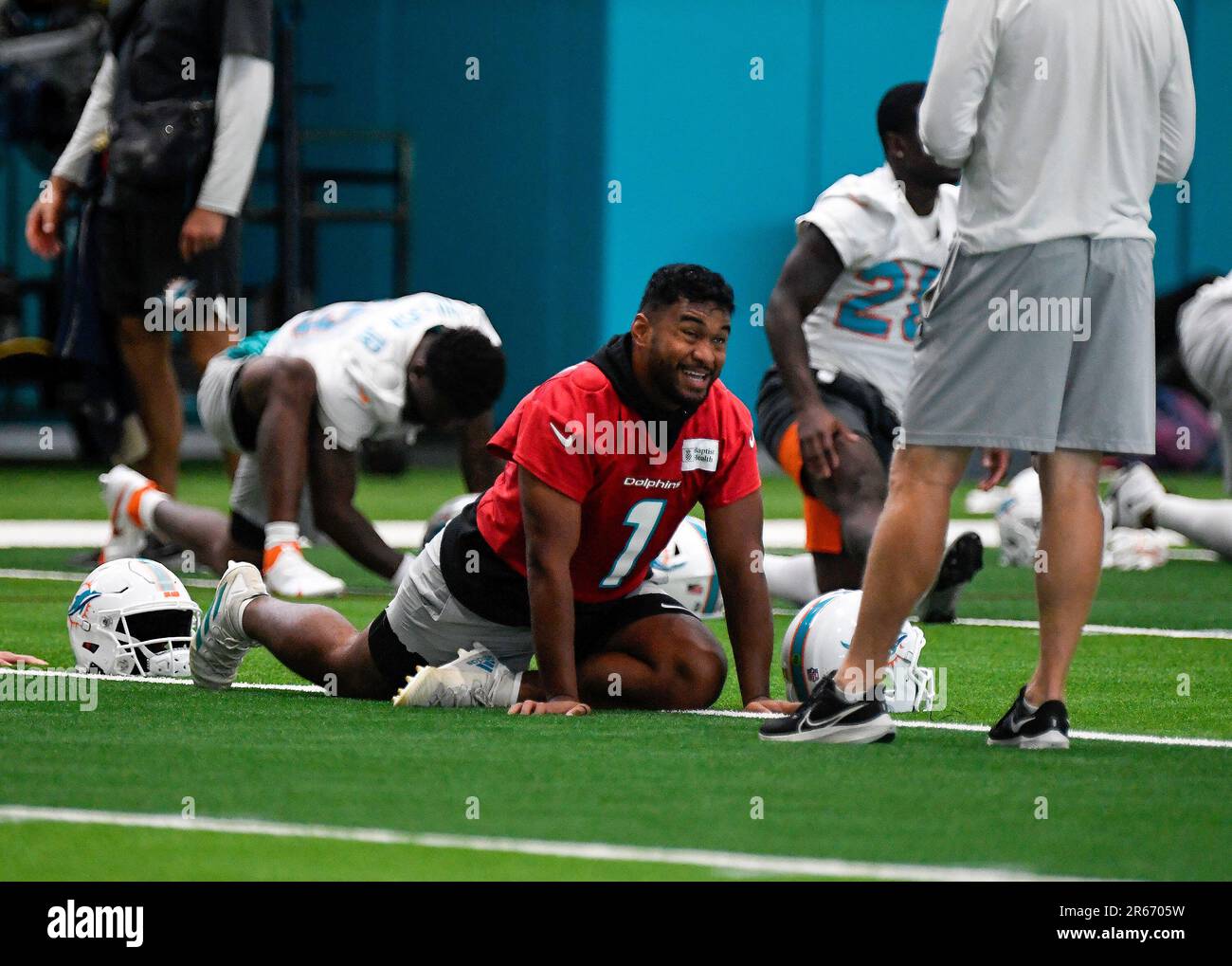Miami Dolphins quarterback Tua Tagovailoa (1) stretches during practice ...
