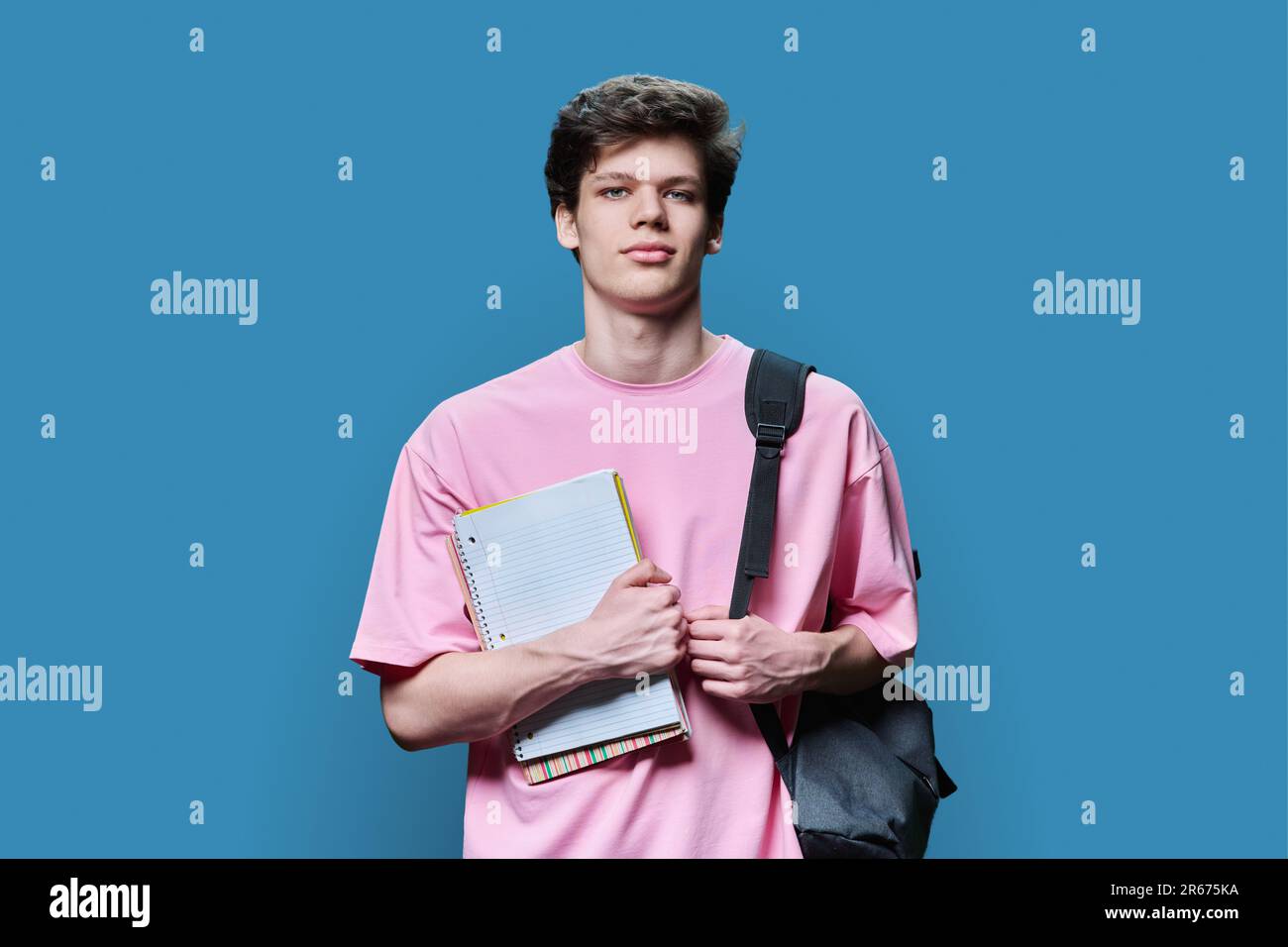 College student standing books backpack hi-res stock photography and ...