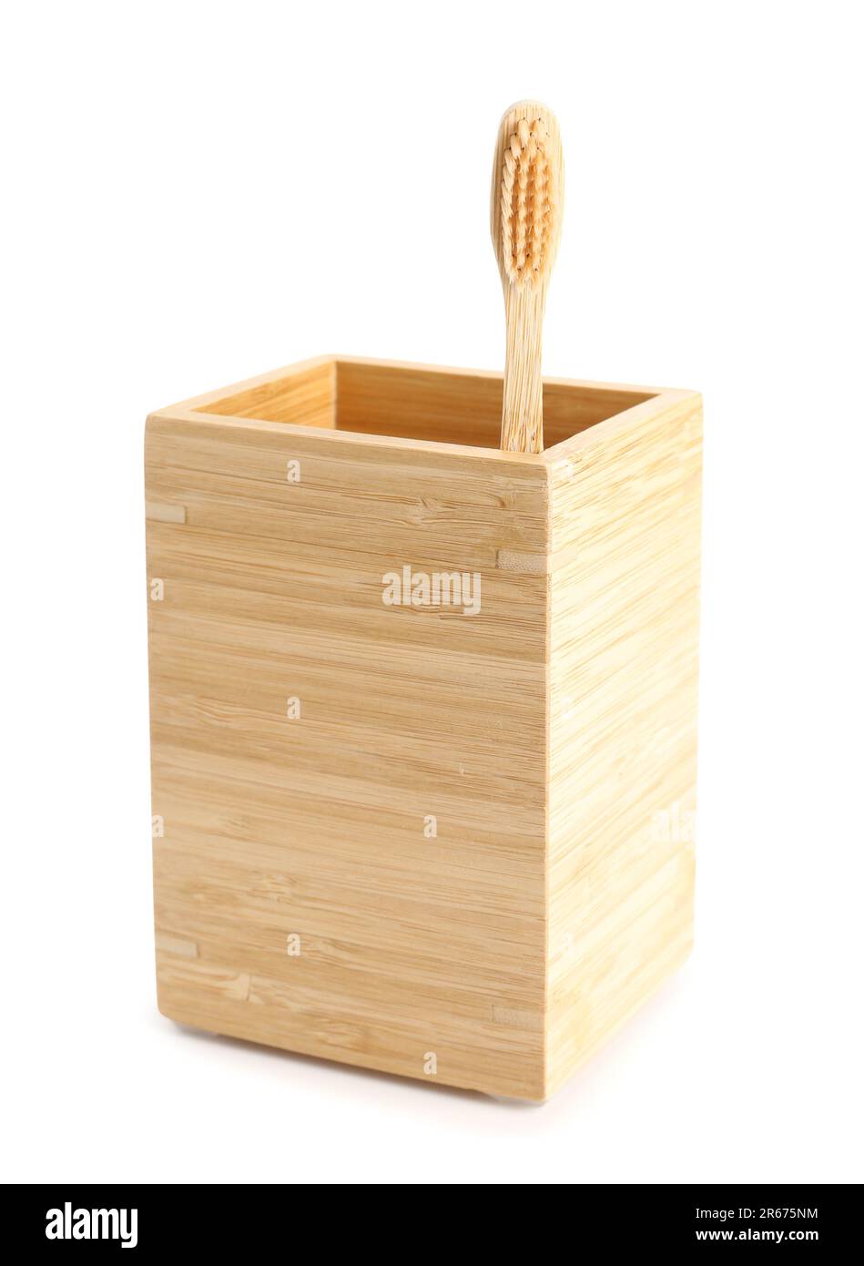 Bamboo tooth brush in holder on white background Stock Photo - Alamy