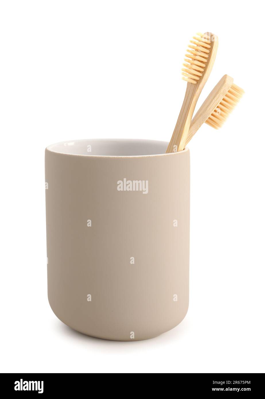 Bamboo tooth brushes in holder on white background Stock Photo - Alamy