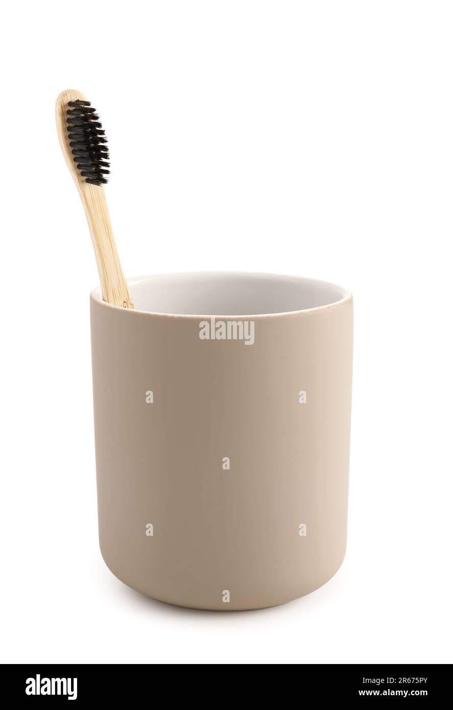 Bamboo tooth brush in holder on white background Stock Photo - Alamy