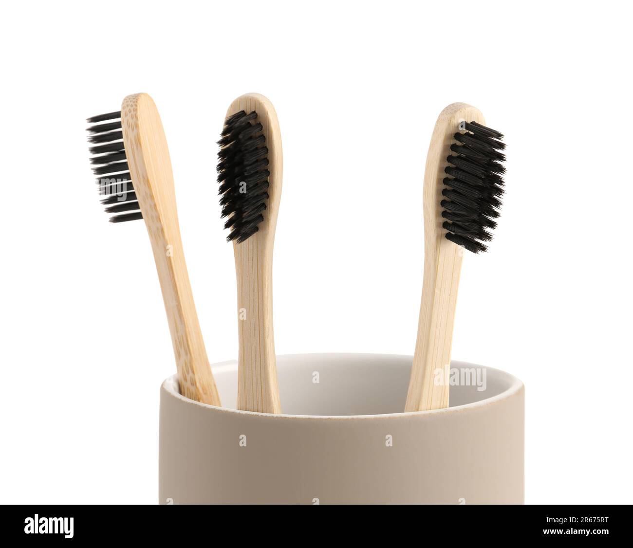 Bamboo tooth brushes in holder on white background, closeup Stock Photo ...