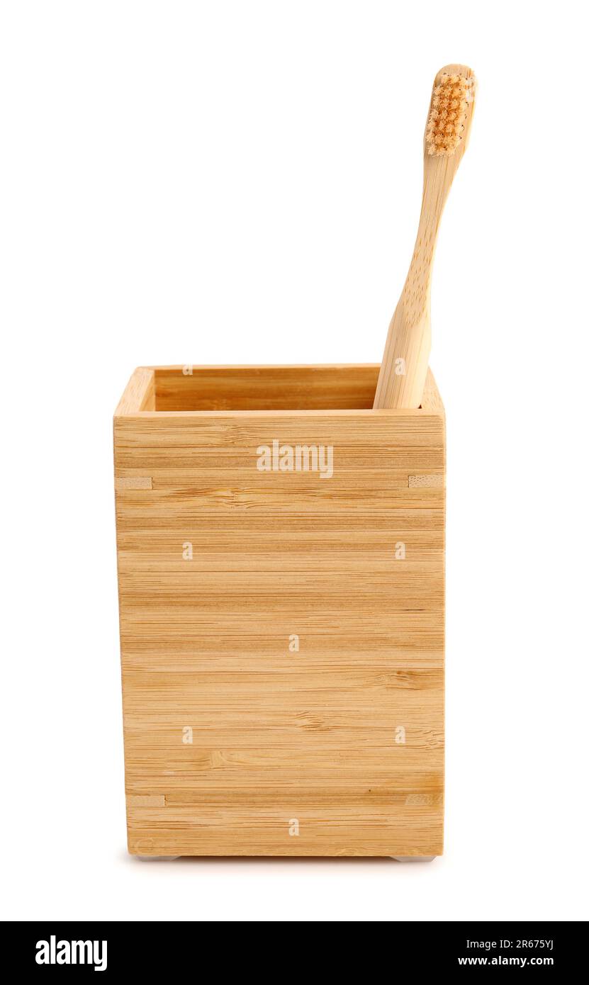 Bamboo tooth brush in holder on white background Stock Photo - Alamy
