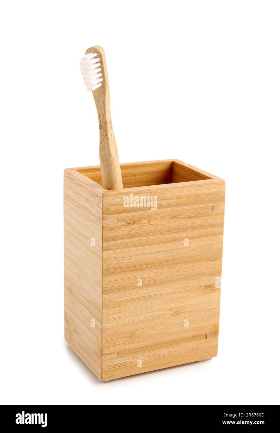 Bamboo tooth brush in holder on white background Stock Photo - Alamy