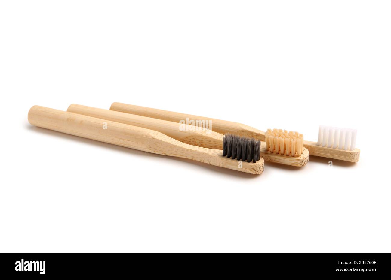 Bamboo tooth brushes on white background Stock Photo - Alamy