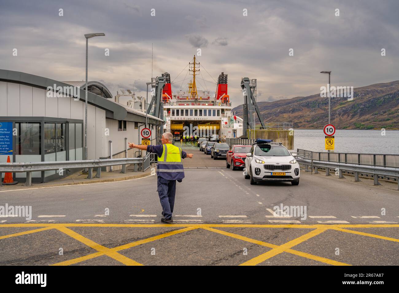 Cars leaving the Calmac Stornaway ferry in Ullapool Scotland Stock