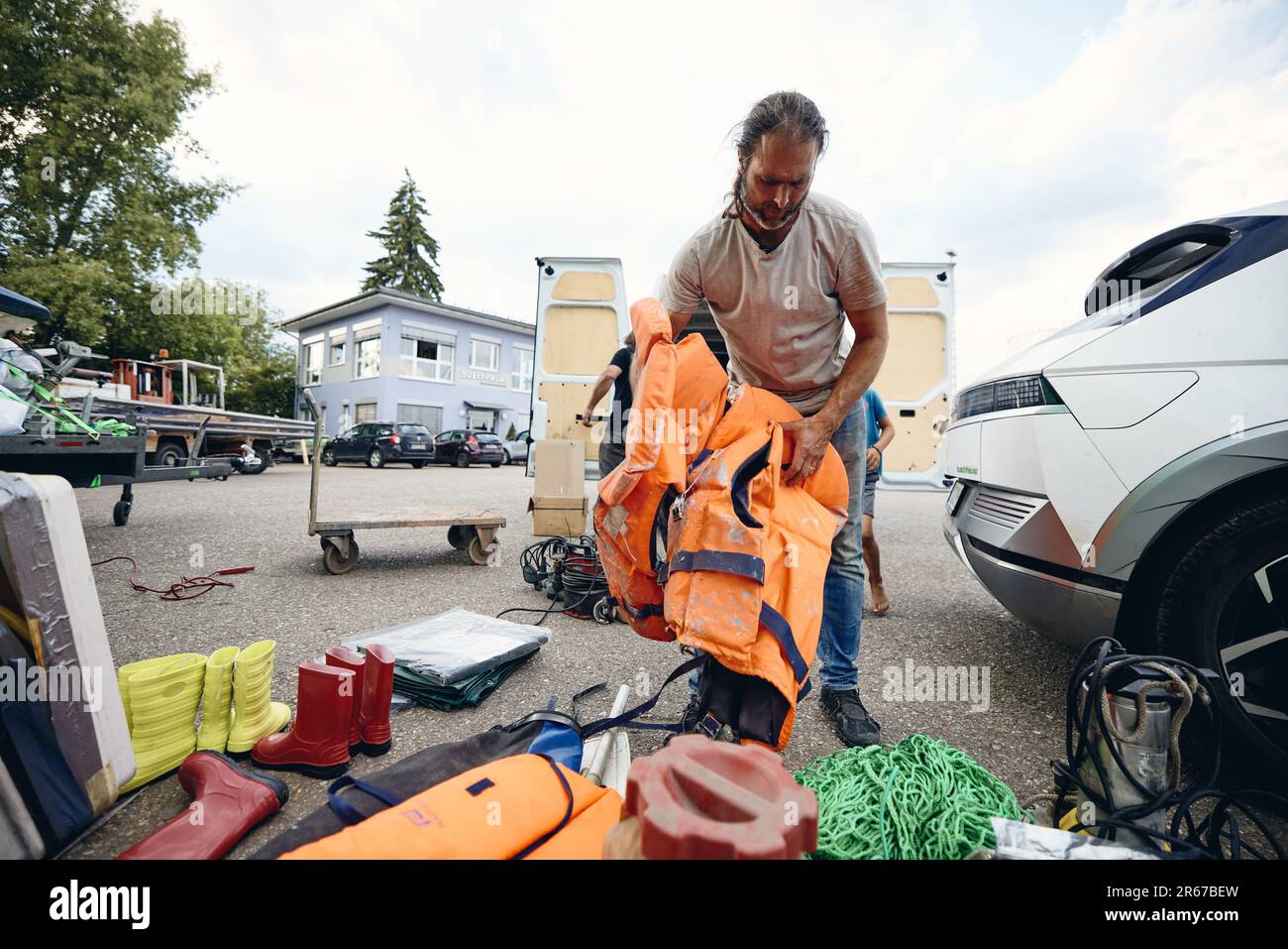 Regensburg, Germany. 07th June, 2023. Michael Buschheuer packs a van with aid supplies for Ukraine. He organizes the aid with his relief organization 'space eye'. Among other things, the transport brings life jackets, rubber boots, blankets, survival suits and sleeping bags to the war-torn country. Credit: Tobias C. Köhler/dpa/Alamy Live News Stock Photo