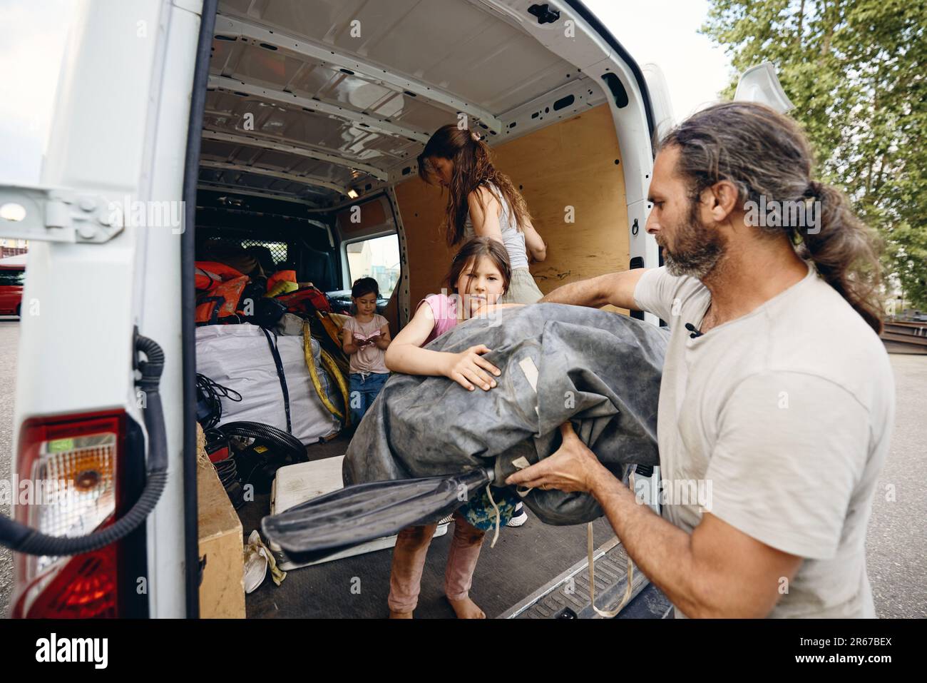 Regensburg, Germany. 07th June, 2023. Together with his wife Hanni and his children, Michael Buschheuer is packing a van with aid supplies for Ukraine. He organizes the aid with his relief organization 'space eye'. Among other things, the transport brings life jackets, rubber boots, blankets, survival suits and sleeping bags to the war-torn country. Credit: Tobias C. Köhler/dpa/Alamy Live News Stock Photo