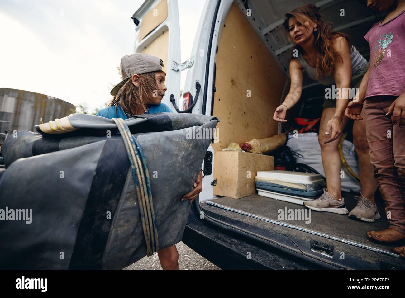 Regensburg, Germany. 07th June, 2023. Hanni Buschheuer and her children are packing a van with aid supplies for Ukraine. Her husband organizes the aid with his relief organization 'space eye'. Among other things, the transport brings life jackets, rubber boots, blankets, survival suits and sleeping bags to the war-torn country. Credit: Tobias C. Köhler/dpa/Alamy Live News Stock Photo