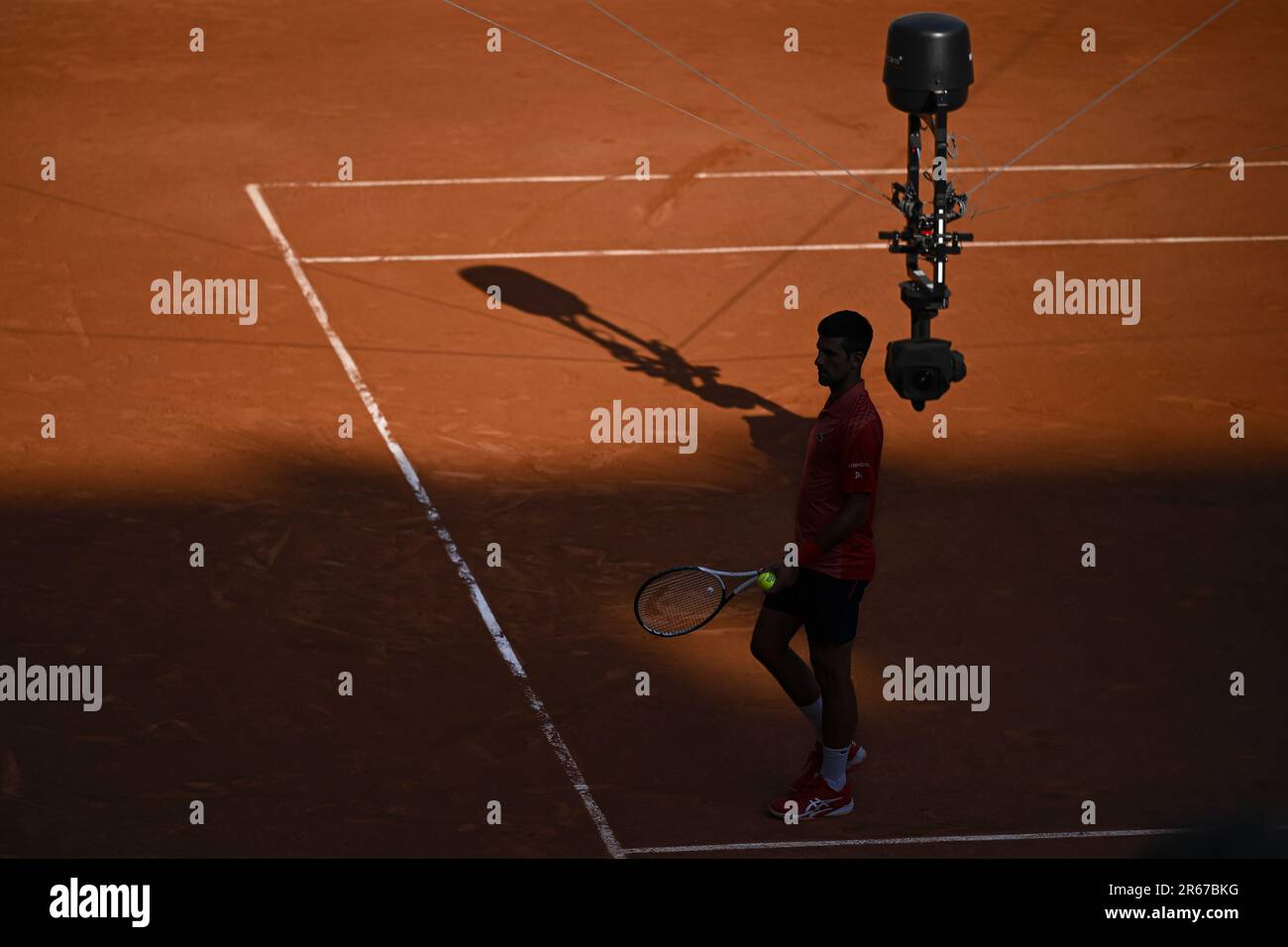 Paris, France - 07/06/2023, Novak Djokovic with a TV television spidercam ( Spider cam camera) during the French Open, Grand Slam tennis tournament on  June 6, 2023 at Roland Garros stadium in Paris,
