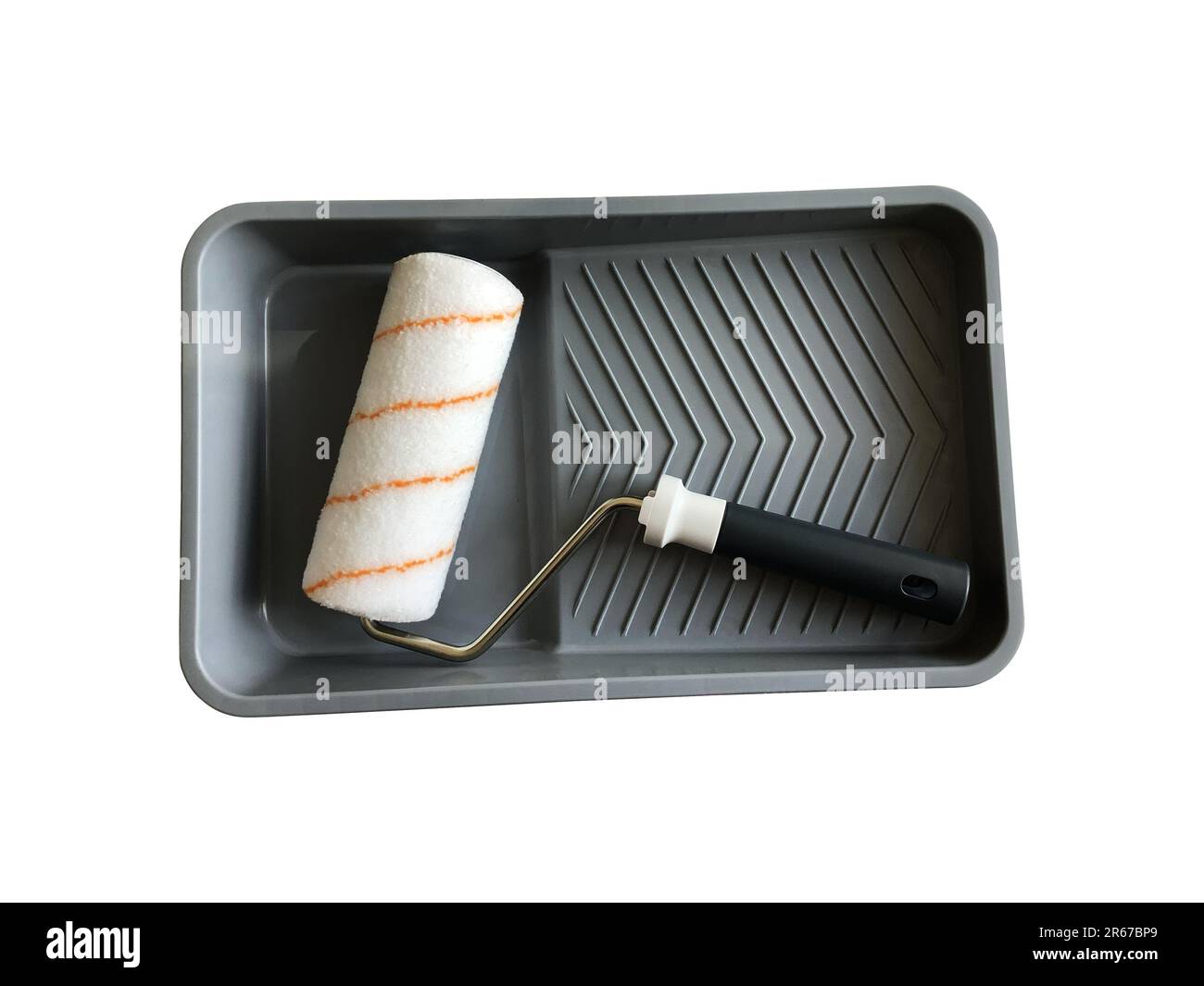 Paint roller in empty tray working tools isolated with clipping path object for making repair works Stock Photo