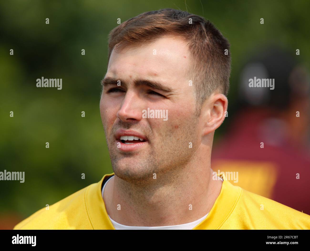 Washington Commanders quarterback Jake Fromm walks to the field before