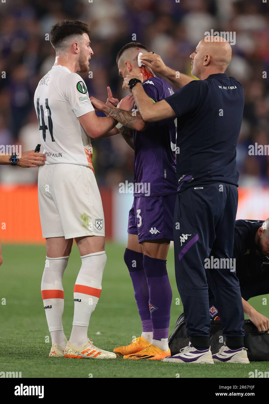 Prague, Czech Republic. 7th June, 2023. Cristiano Biraghi of ACF Fiorentina receives treatment for a wound to the head after allegedly being struck by a cigarette lighter whilst attempting to take a corner kick in front of West Ham United fans during the UEFA Europa Conference League match at the Eden Arena, Prague. Picture credit should read: Jonathan Moscrop/Sportimage Credit: Sportimage Ltd/Alamy Live News Stock Photo