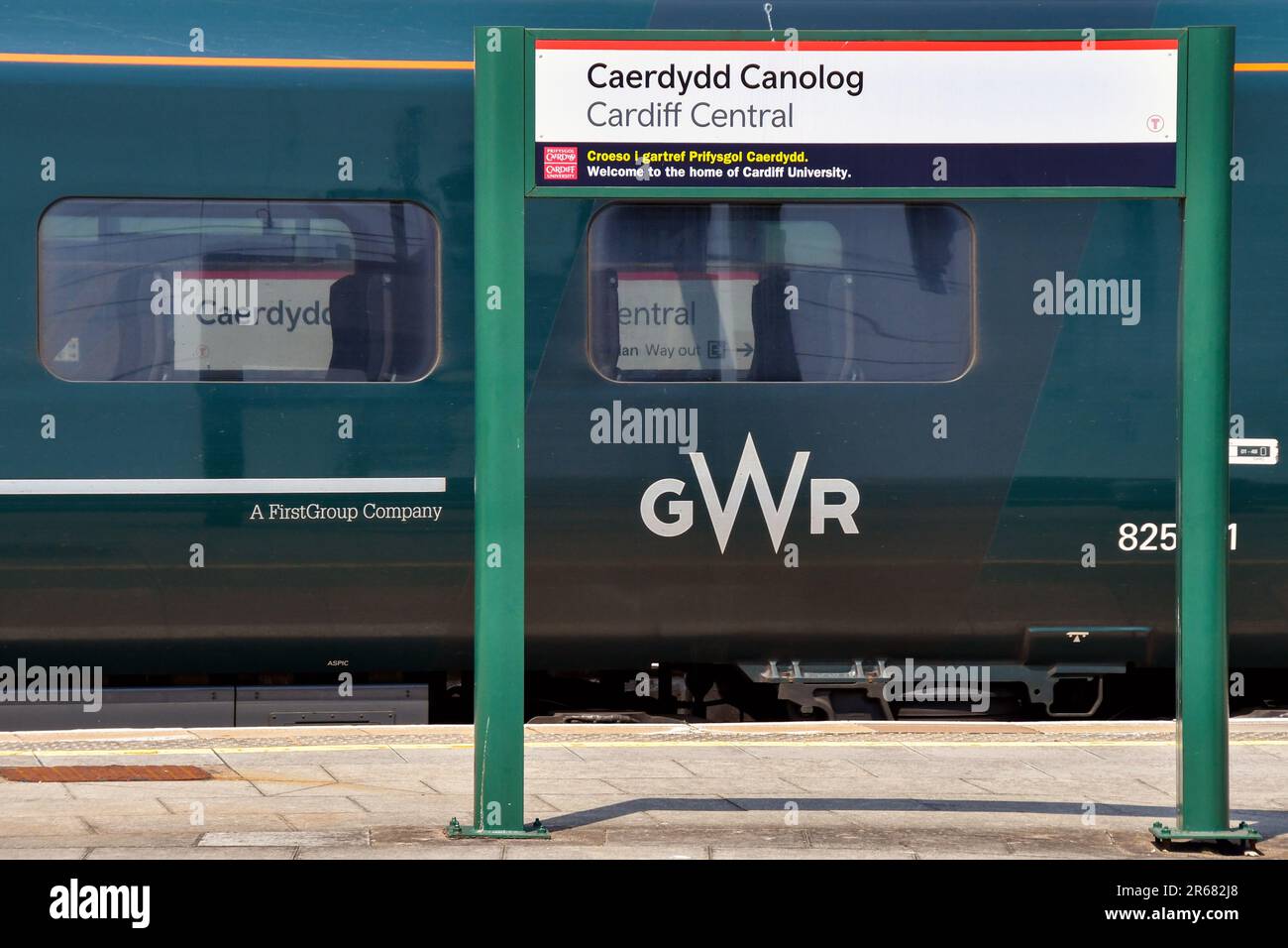 Cardiff, Wales - June 2023: High speed train operated by Great western Railway alongside a platform sign for Cardiff Central railway station Stock Photo