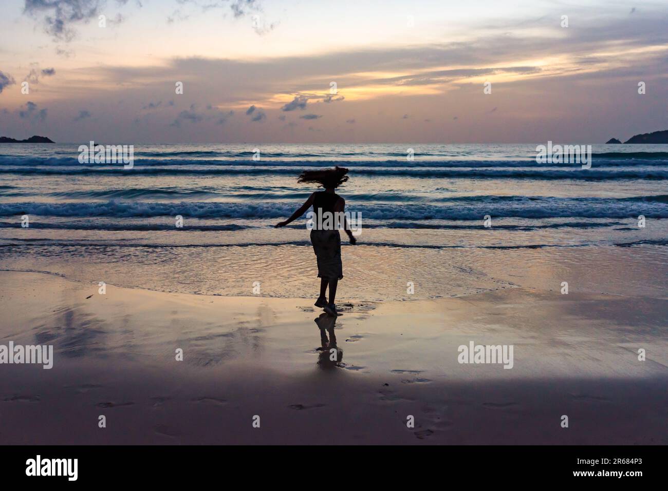 Woman dancing beach alone hi-res stock photography and images - Alamy