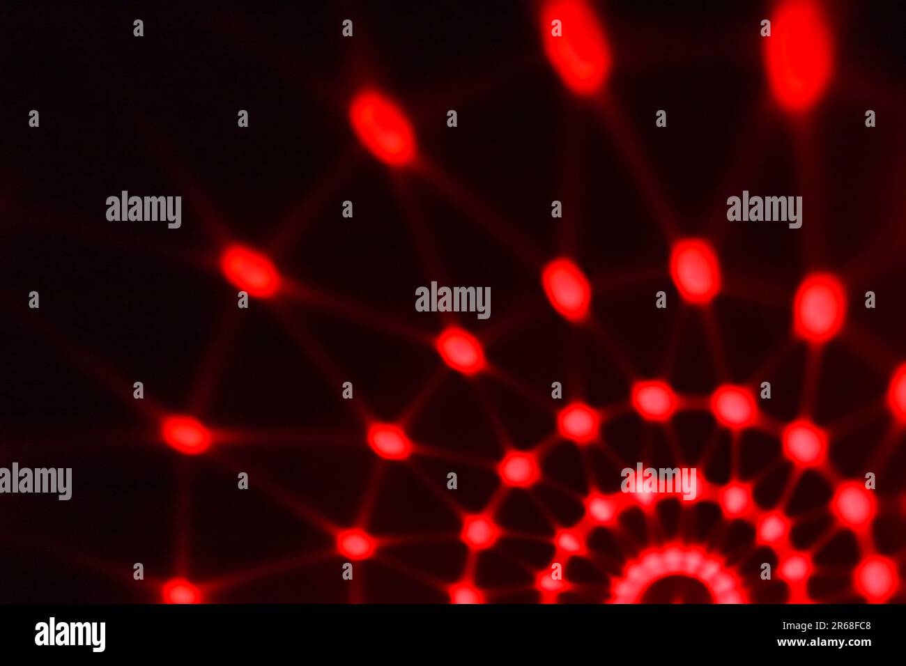 Abstraction in the form of red lights on a dark background. Night concept. Stock Photo