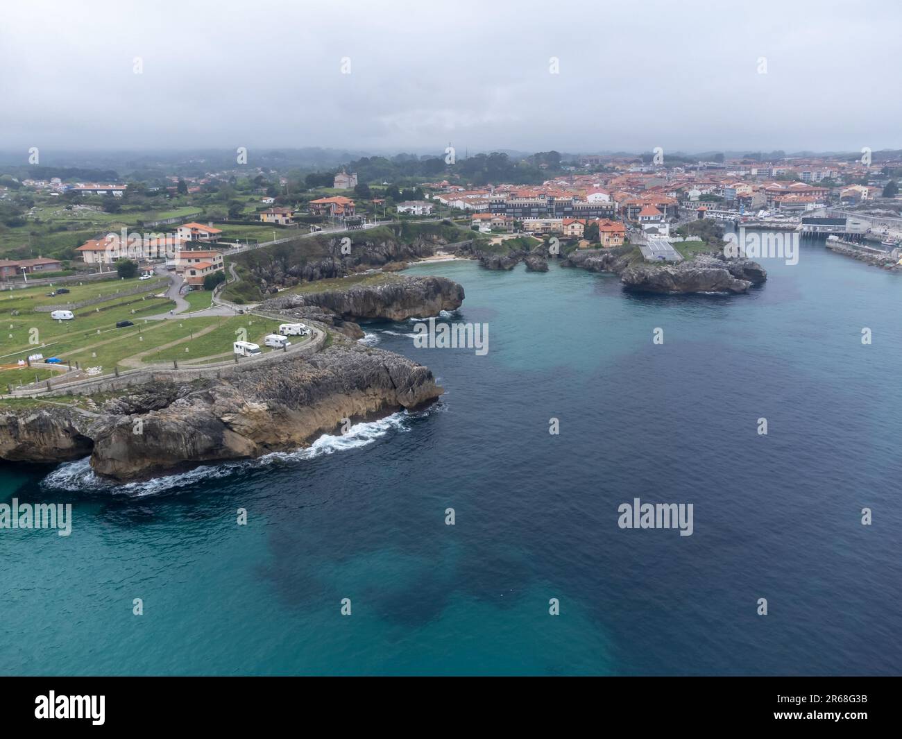 aerial-view-on-playa-de-toro-and-old-harbour-of-llanes-green-coast-of