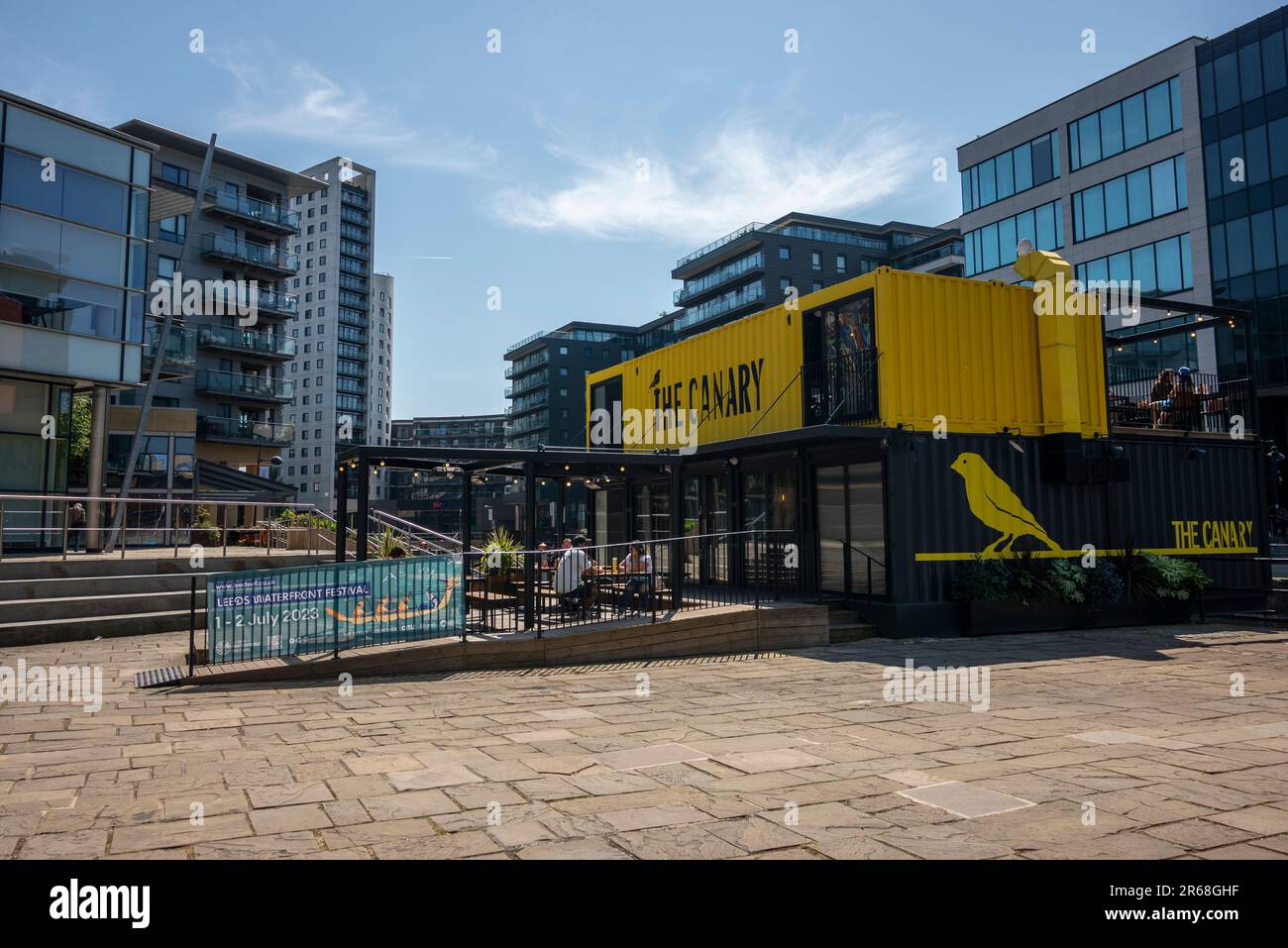 The Canary, yellow painted bar pub in leeds Dock area of Leeds Stock