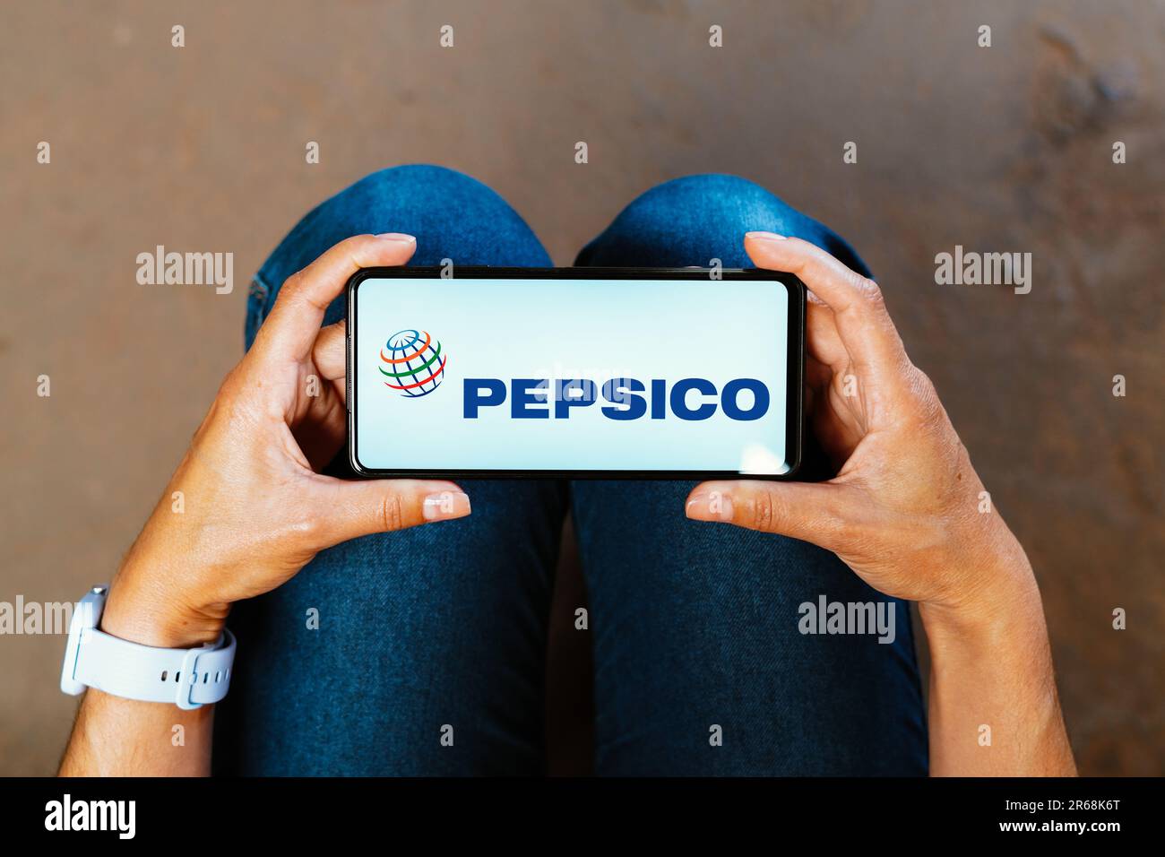 In this photo illustration, the PepsiCo logo is displayed on a