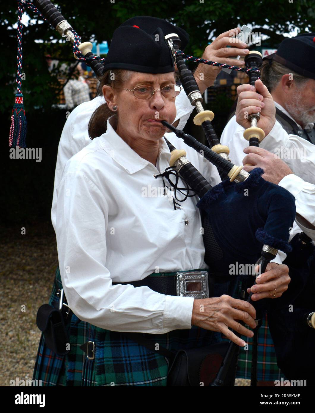 Members of the Appalachian Highlanders Pipes and Drums tune their bagpipes as the prepare to particpate in a public event in Abingdon, Virginia. Stock Photo