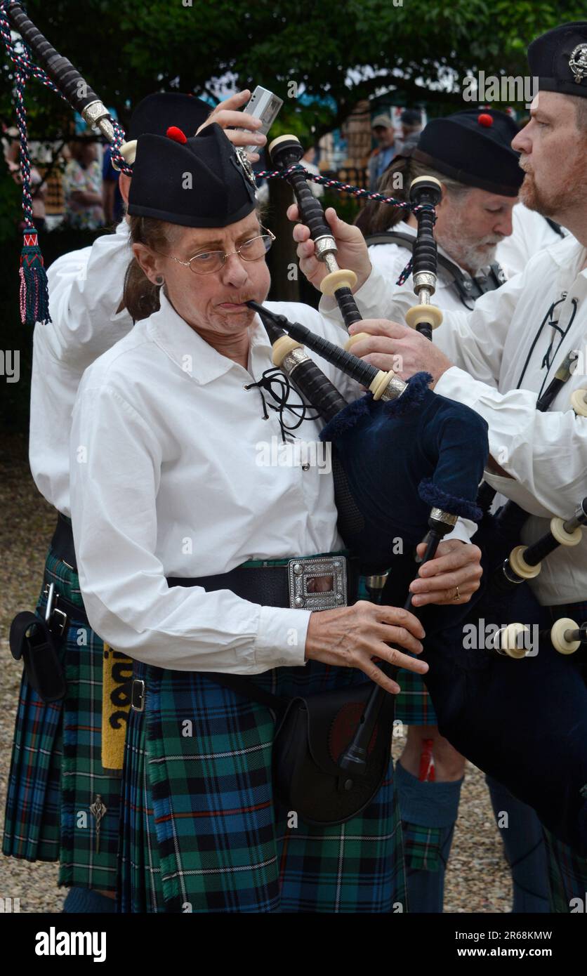 Members of the Appalachian Highlanders Pipes and Drums tune their bagpipes as the prepare to particpate in a public event in Abingdon, Virginia. Stock Photo