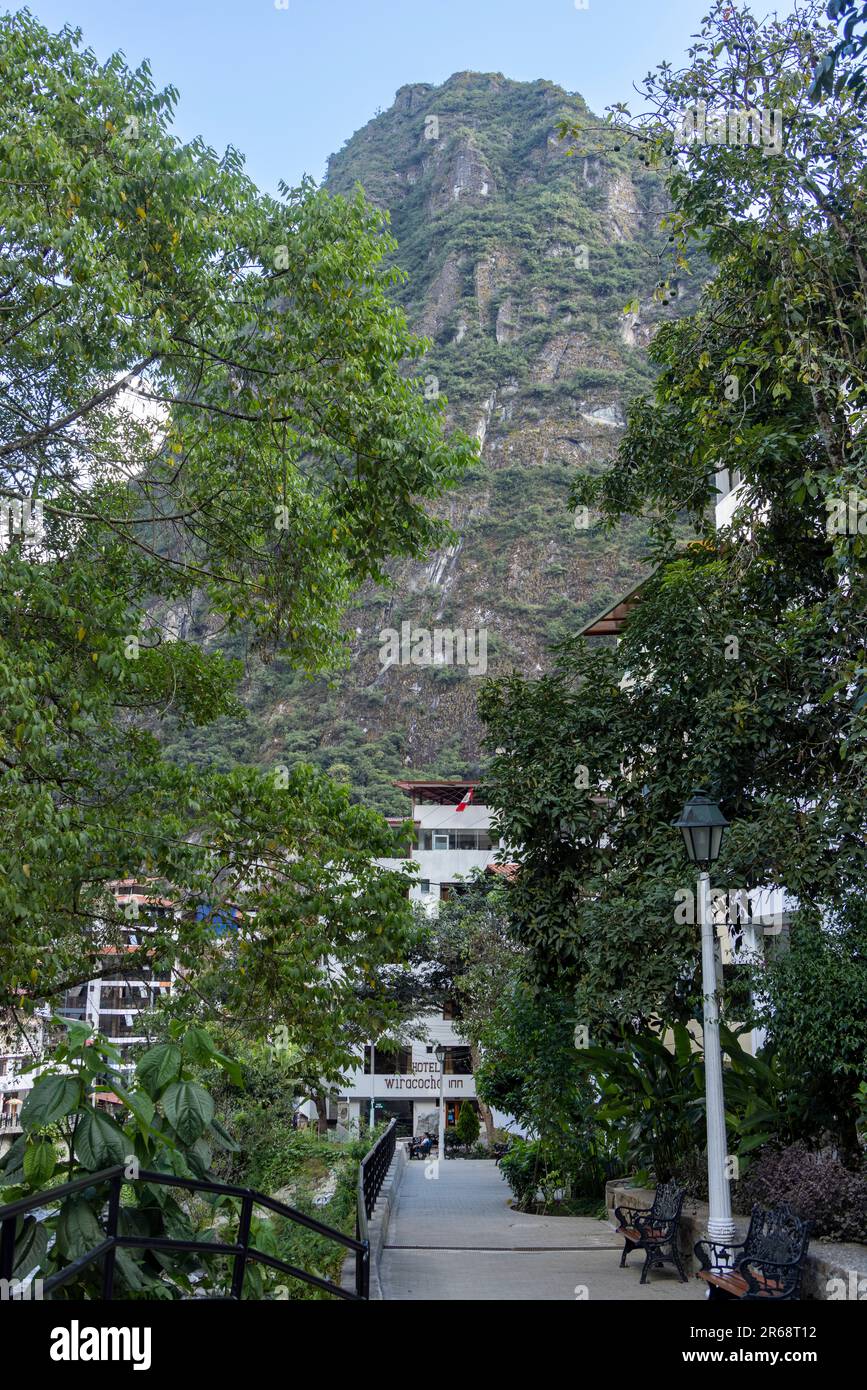 view of the tourist town surrounded by mountains, Agua Calientes, Peru Stock Photo