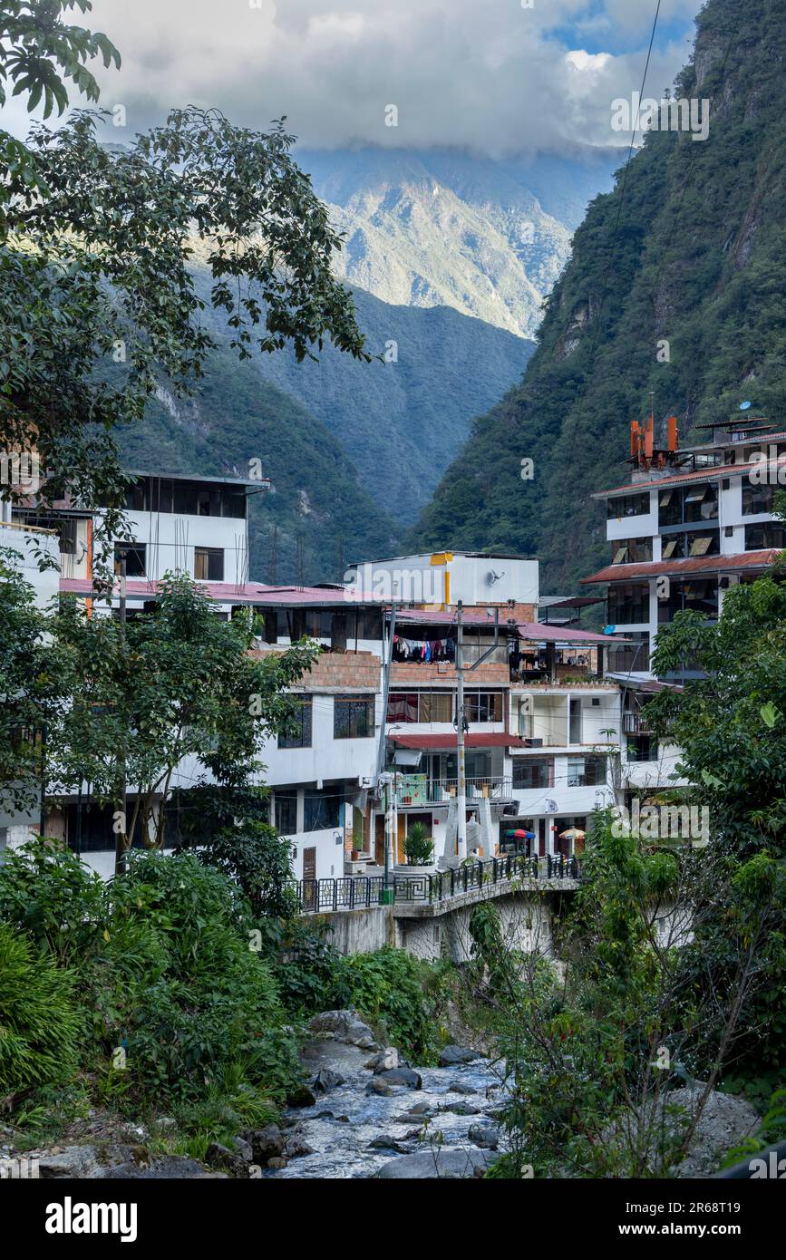 view of the tourist town surrounded by mountains, Agua Calientes, Peru Stock Photo
