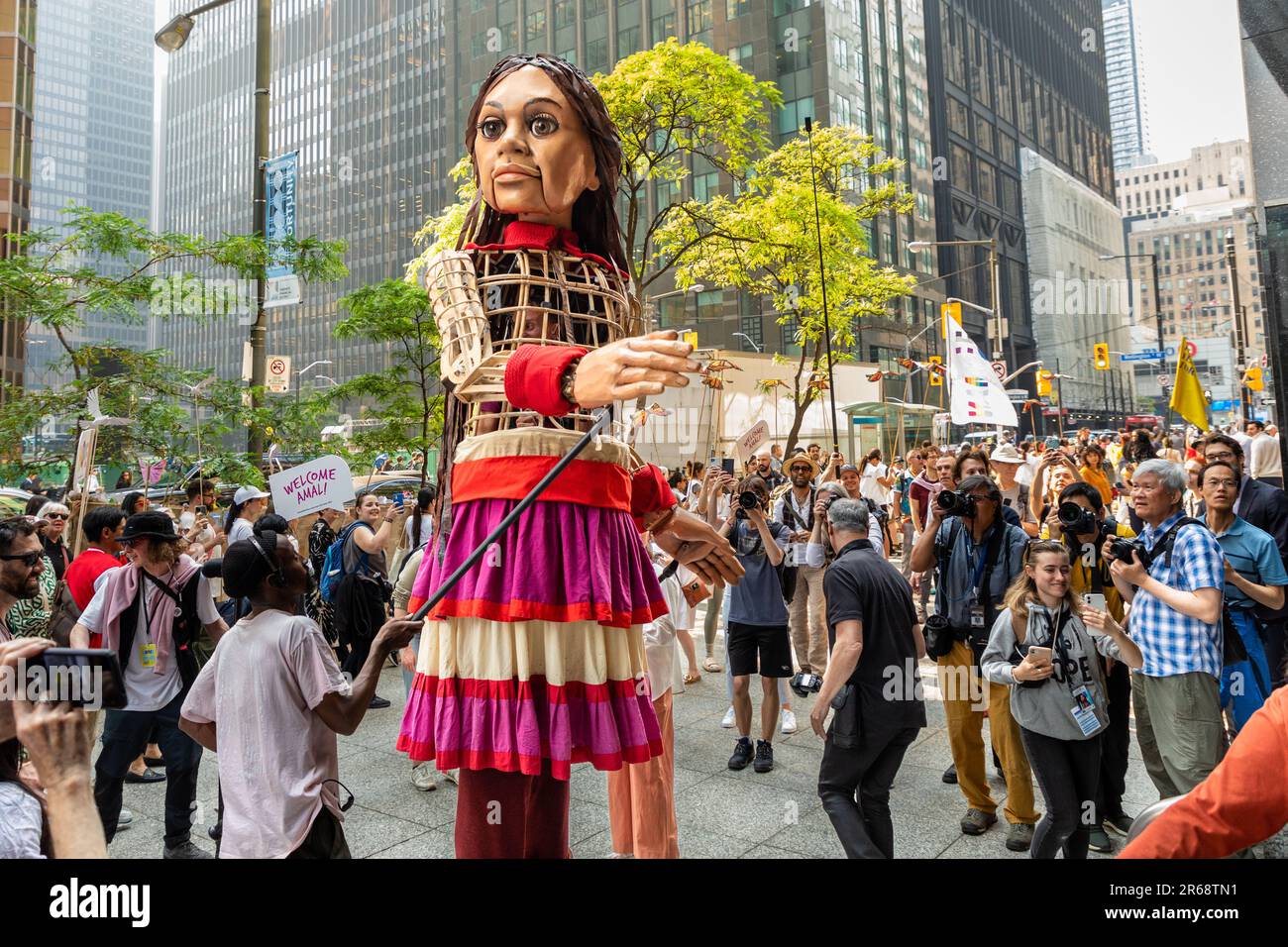 Toronto, Canada - June 07 2023: Hundreds of Indigenous people, social-justice activists and supporters welcomed 'Little Amal.' The 3.6-metre (12-foot) puppet, symbolizing a 10-year-old Syrian refugee, led a peaceful march through downtown Toronto  as part of a global campaign Stock Photo