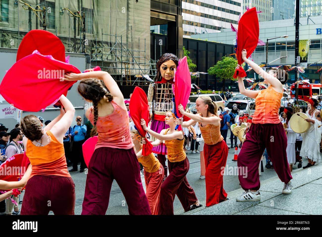 Toronto, Canada - June 07 2023: Hundreds of Indigenous people, social-justice activists and supporters welcomed 'Little Amal.' The 3.6-metre (12-foot) puppet, symbolizing a 10-year-old Syrian refugee, led a peaceful march through downtown Toronto  as part of a global campaign Stock Photo