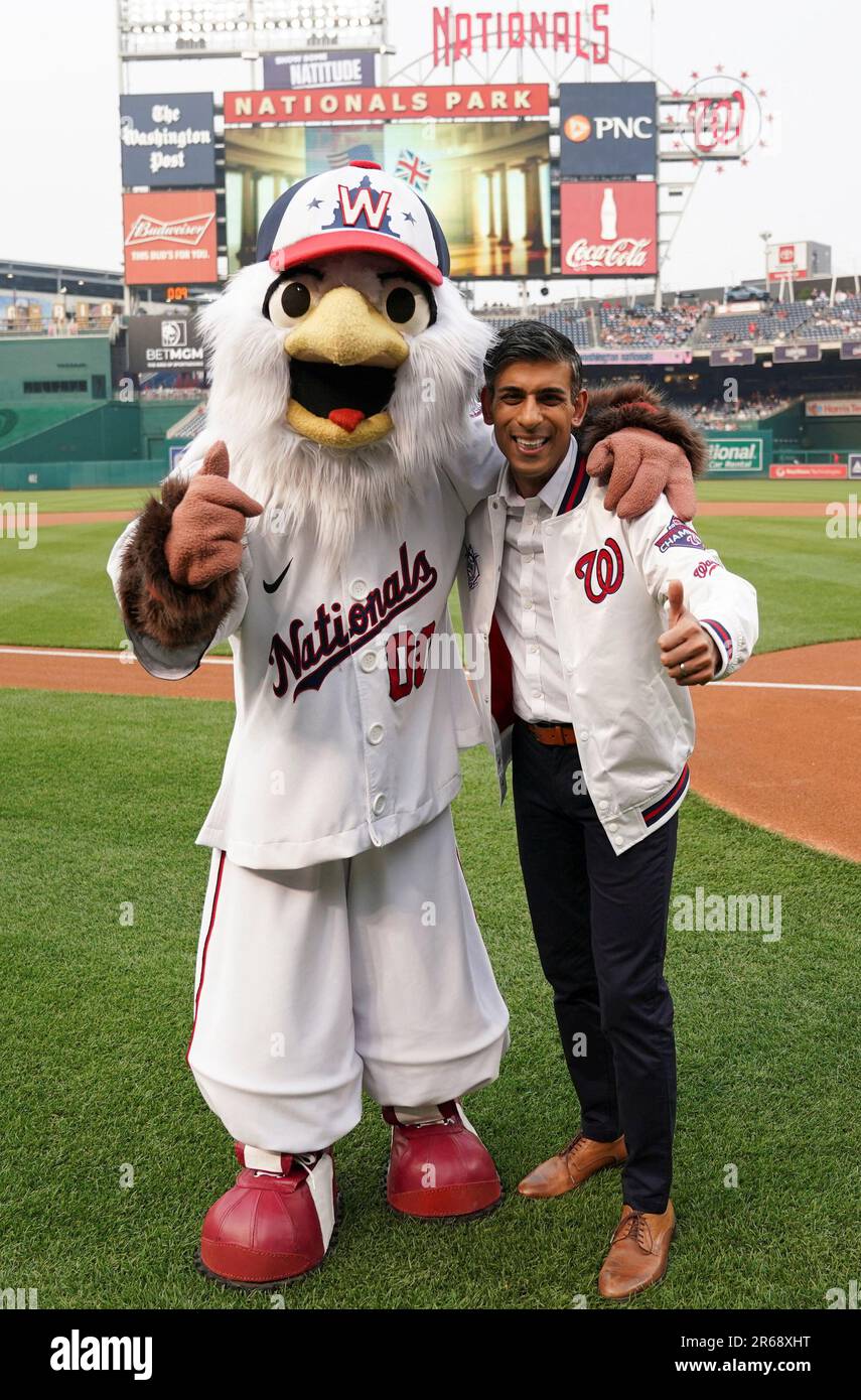 Prime Minister Rishi Sunak poses with Washington Nationals mascot Screech,  as he attends the Washington Nationals v Arizona Diamondbacks baseball at  Nationals Park during his visit to Washington DC in the US.