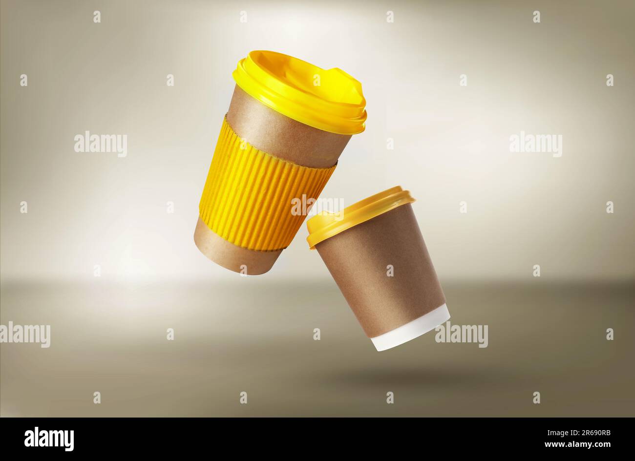 Takeaway paper cups falling on beige background Stock Photo