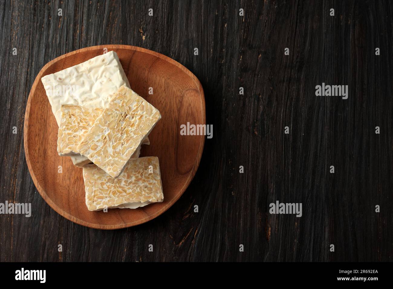 Sliced Raw Tempeh, Fermented Soybean, Copy Space for Text Stock Photo