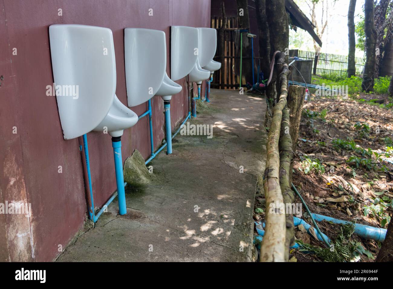 Outdoor men's toilets urinals in the forest restaurant, Thailand