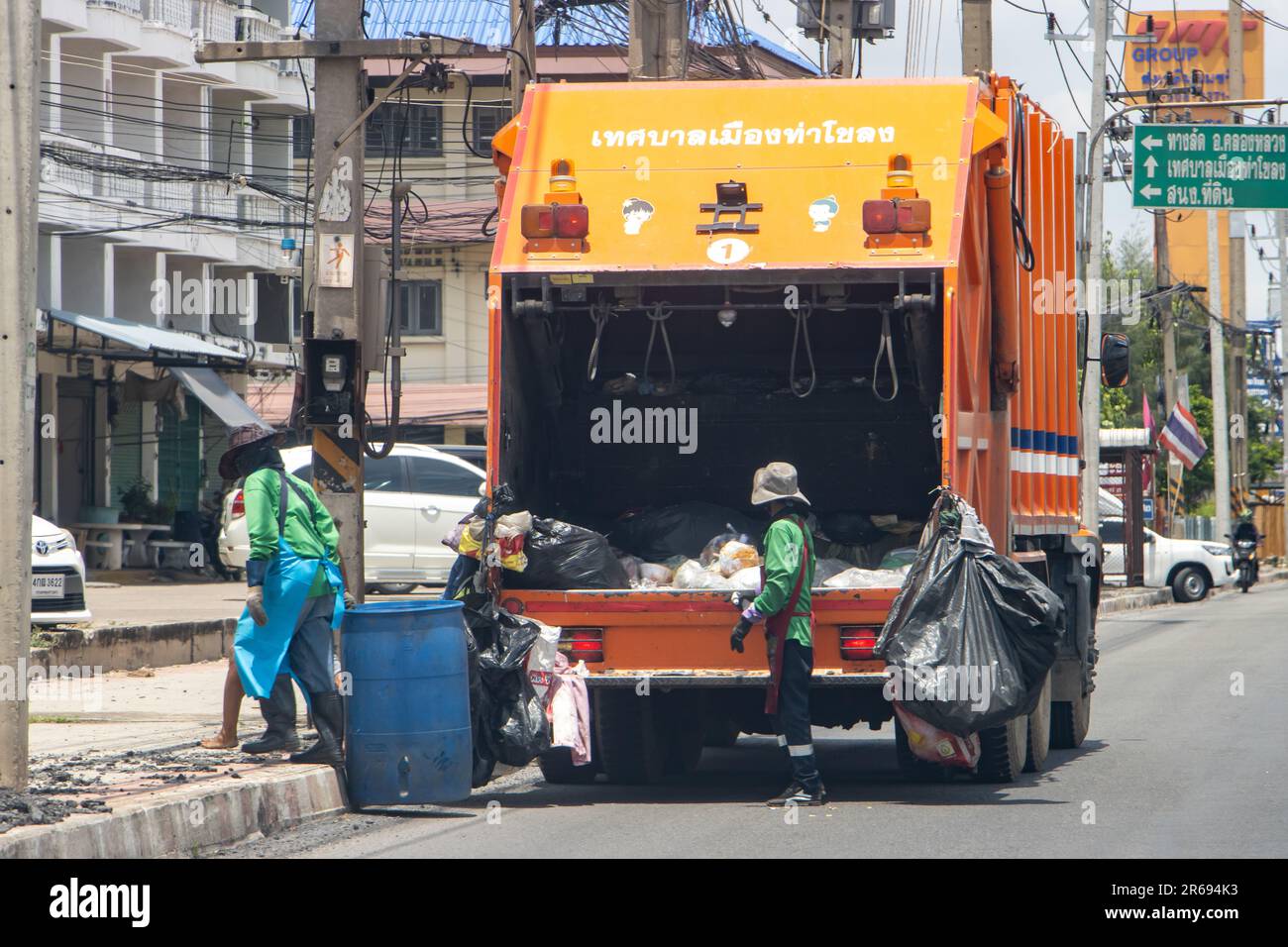BANGKOK, THAILAND, JUNE 03 2023, Cleaning up garbage with a garbage