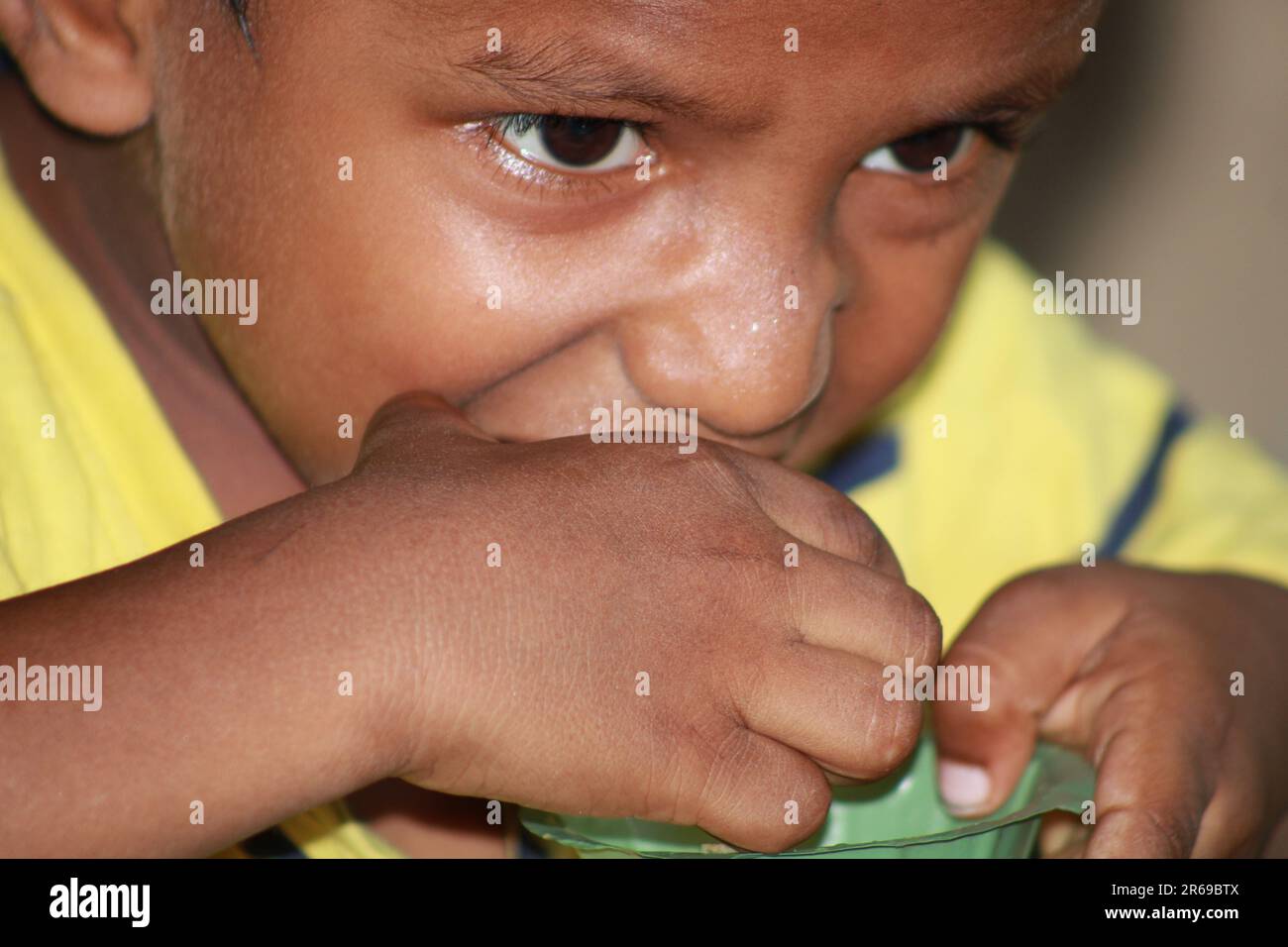 Indian little boy is eating water balls Stock Photo