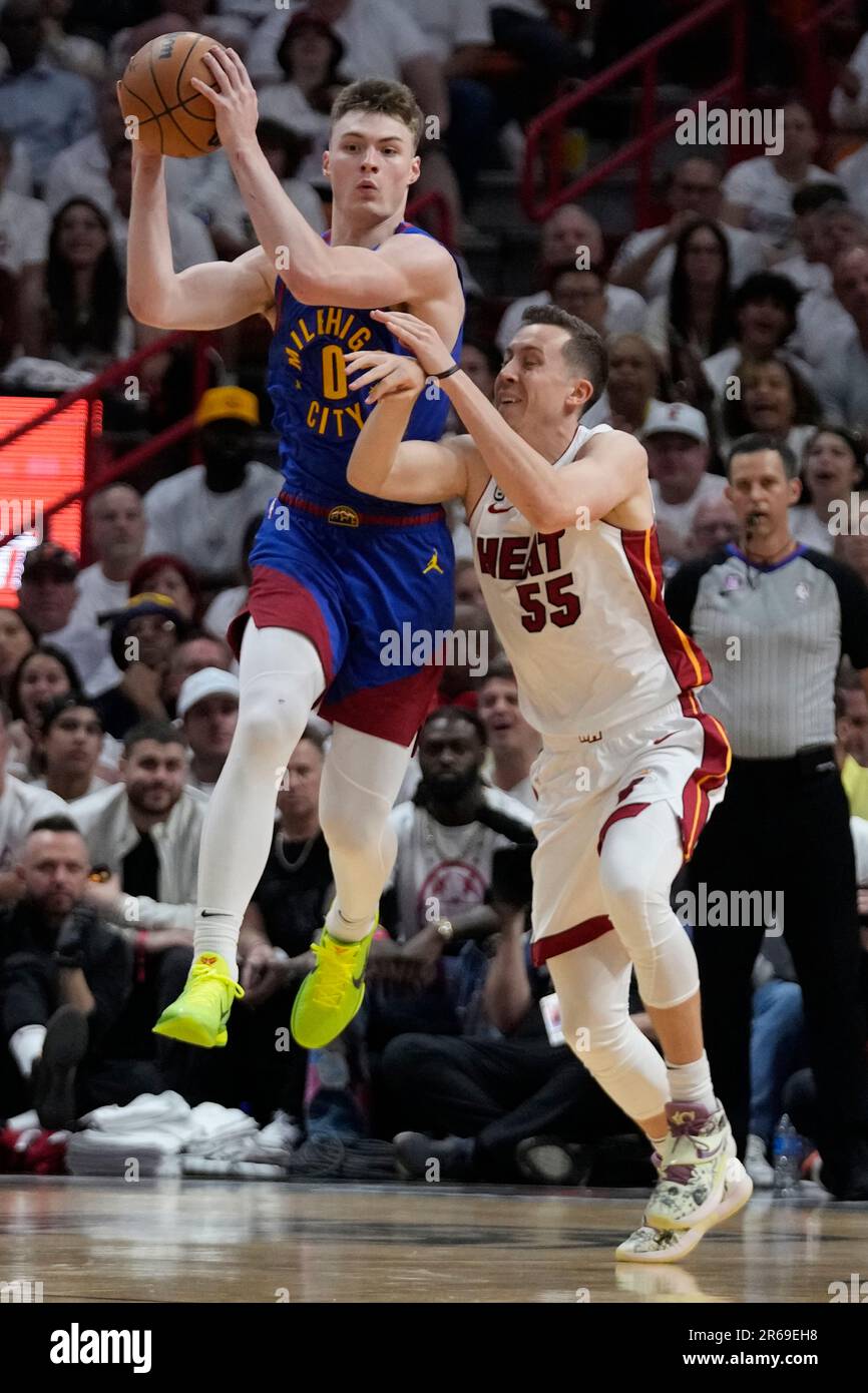 Denver Nuggets guard Christian Braun (0) shoots the ball against the Miami  Heat during the first
