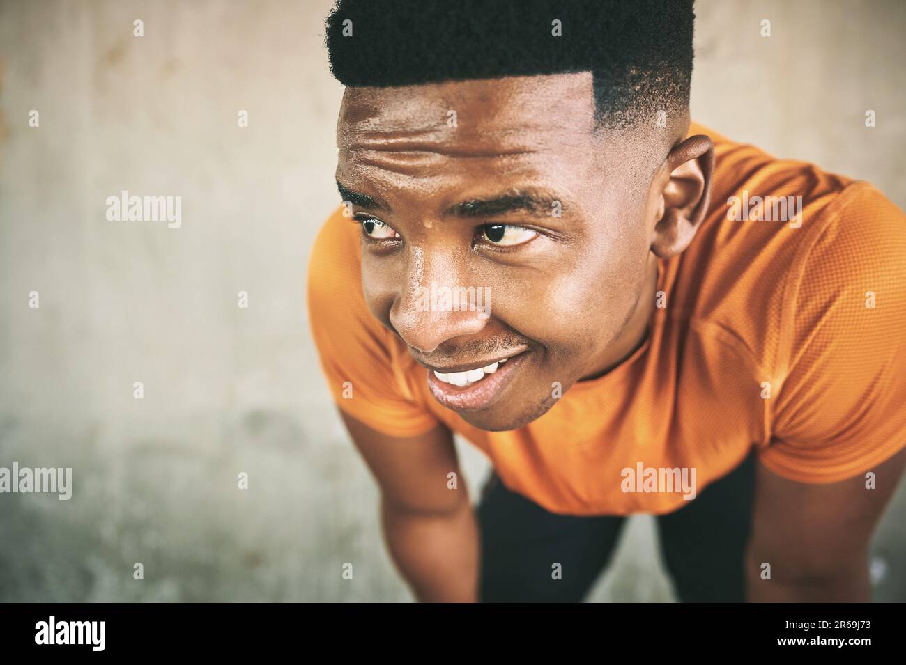 Im not dripping in sweat, Im dripping in success. a young man taking a