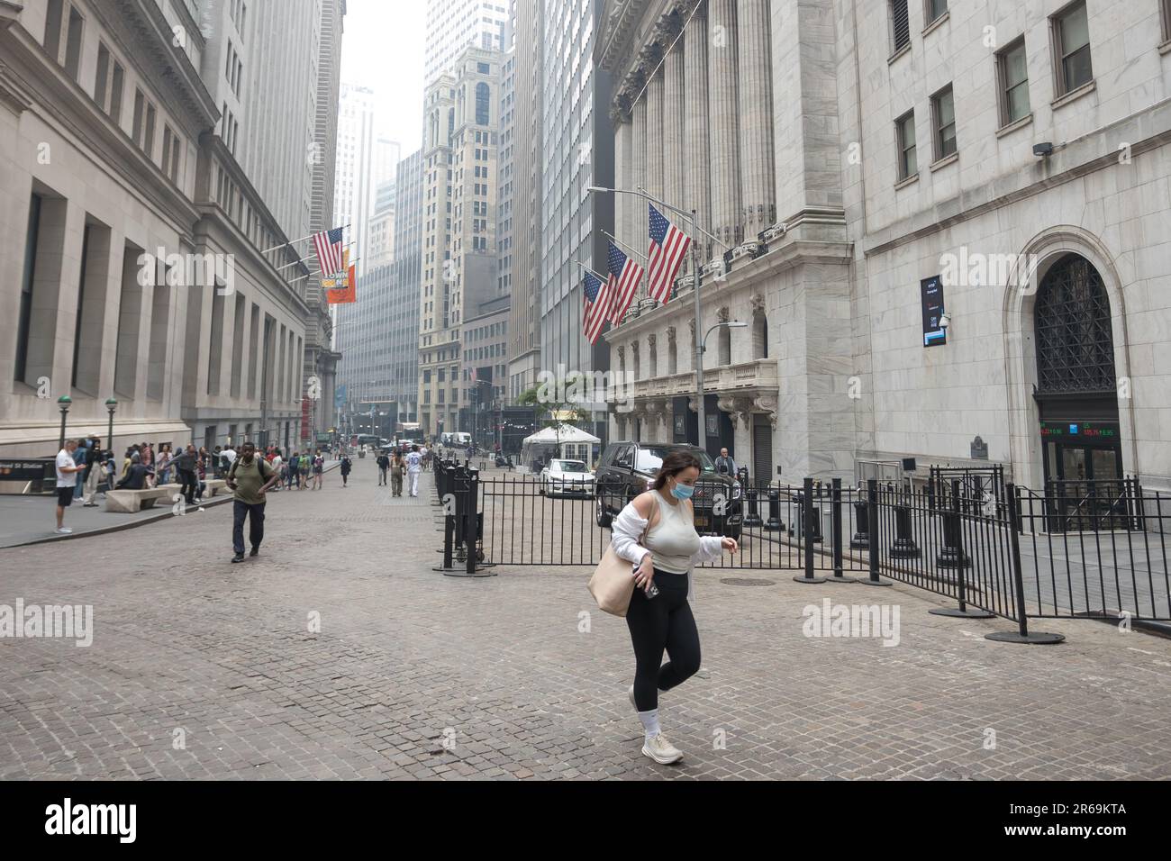 New York City, NY, USA. 7th June, 2023. People wear face masks in the