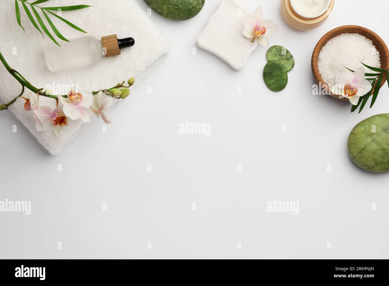 Flat lay composition with different spa products on white background ...