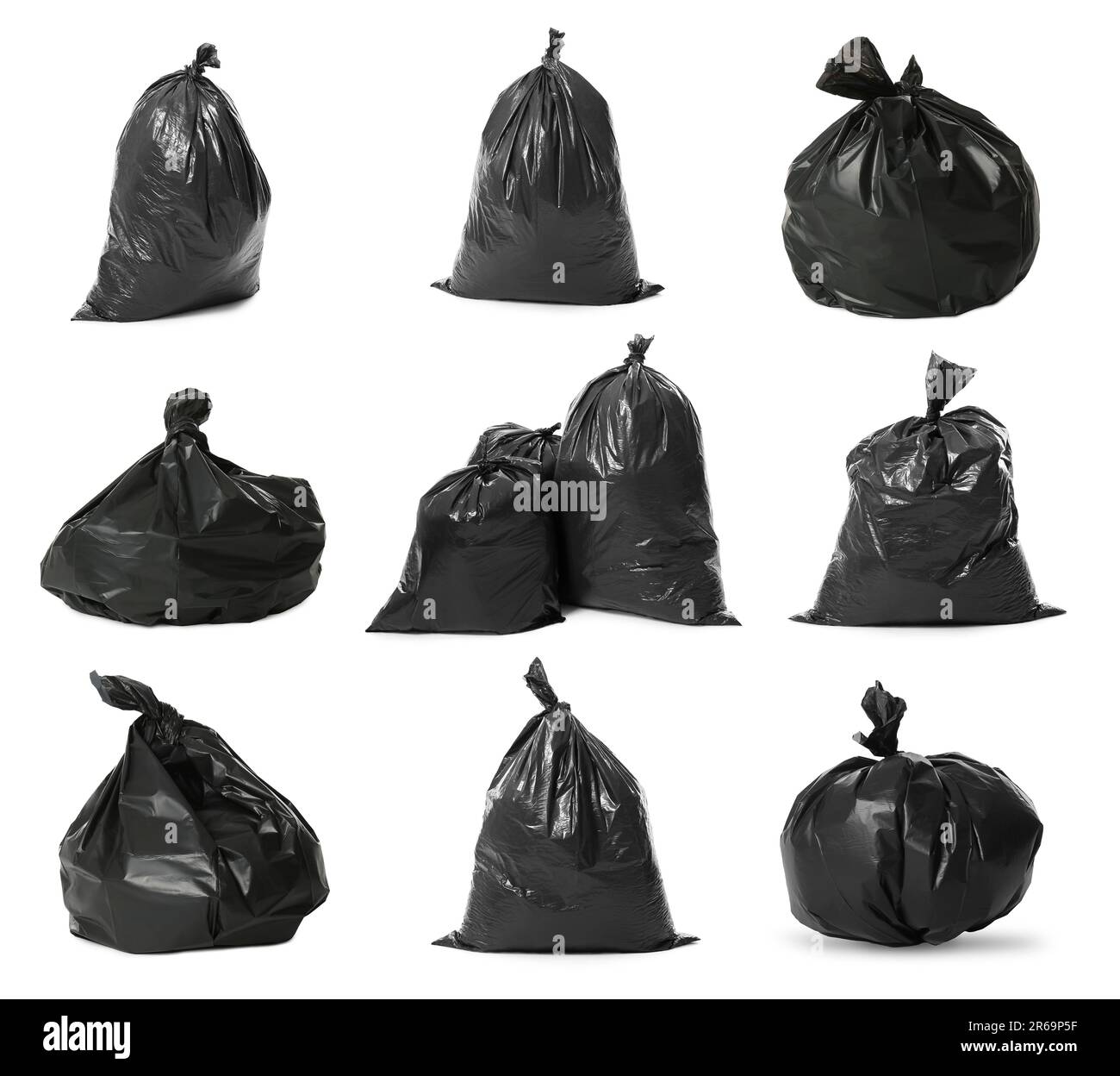 Set with black trash bags full of garbage on white background Stock