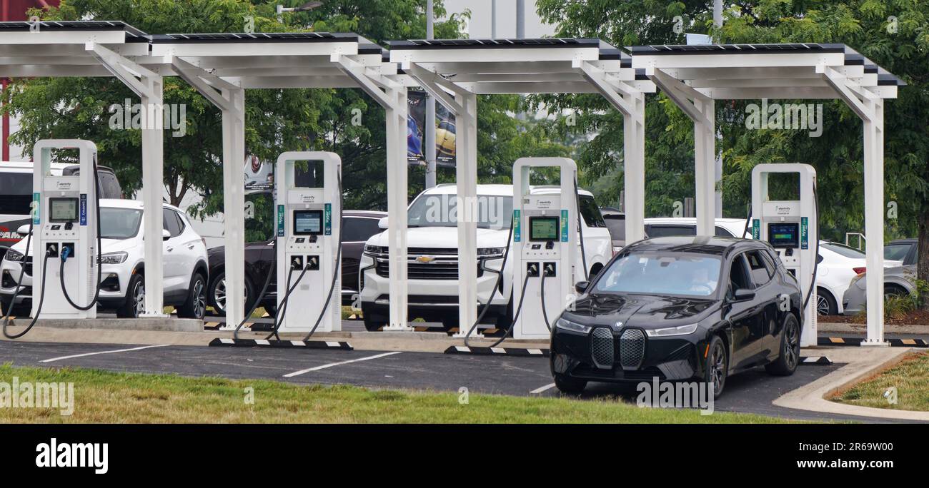 A driver waits while recharging the battery unit of his BMW electric vehicle at a four-unit Electrify America direct current EV charging station on Wednesday, June 7, 2023 at the National Corvette Museum in Bowling Green, Warren County, KY, USA. A subsidiary of Volkswagen Group of America, Electrify America was established in 2016 and currently operates a network of more than 788 electric vehicle charging locations in the United States, including four in the state of Kentucky. (Apex MediaWire Photo by Billy Suratt) Stock Photo
