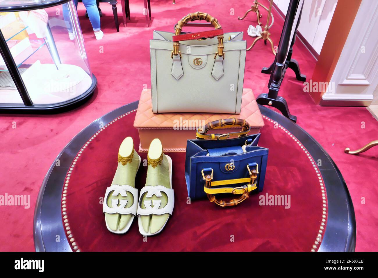 GUCCI BAGS AND SHOES ON DISPLAY INSIDE THE FASHION STORE Stock Photo - Alamy